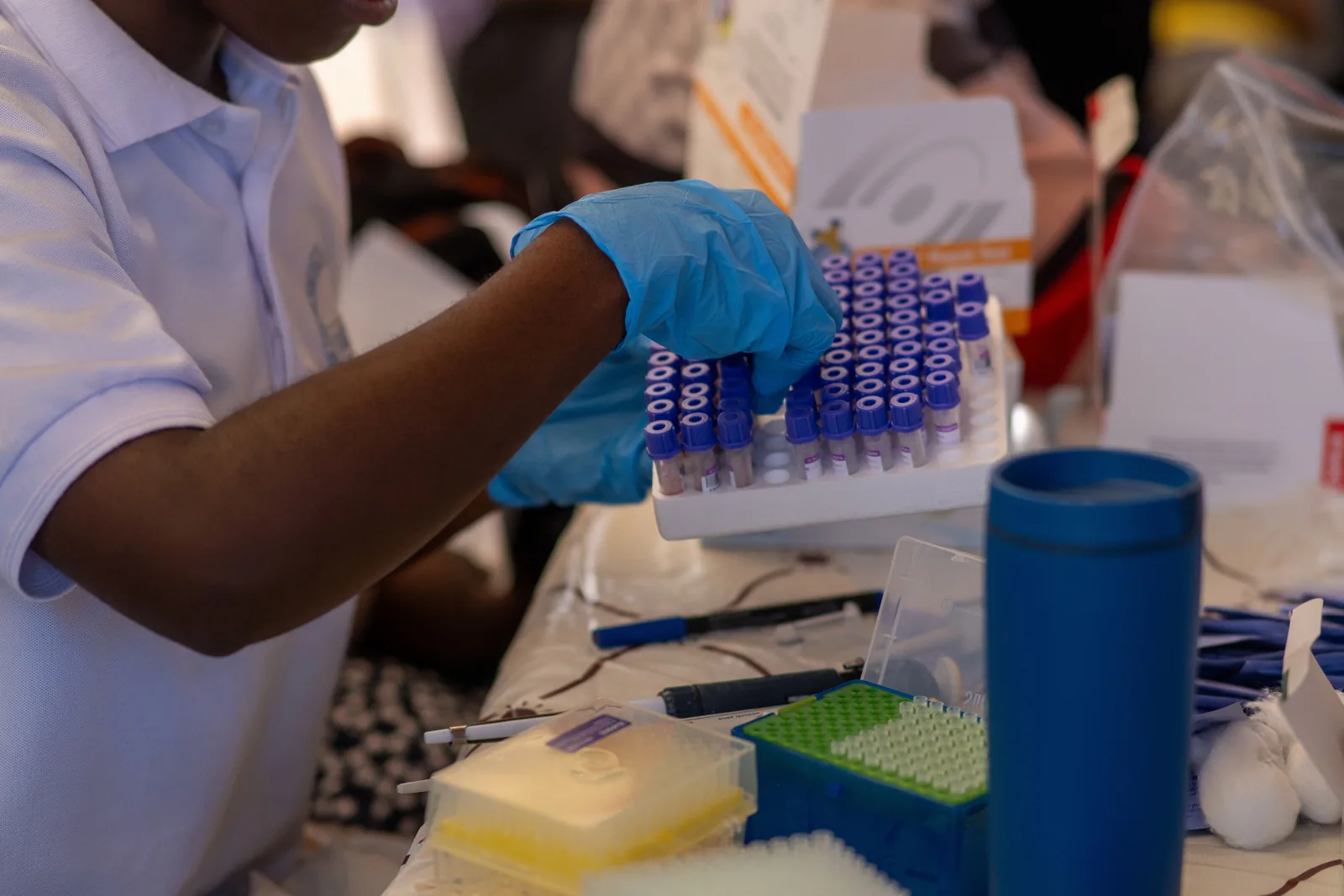 Representative laboratory technician organizing test tubes